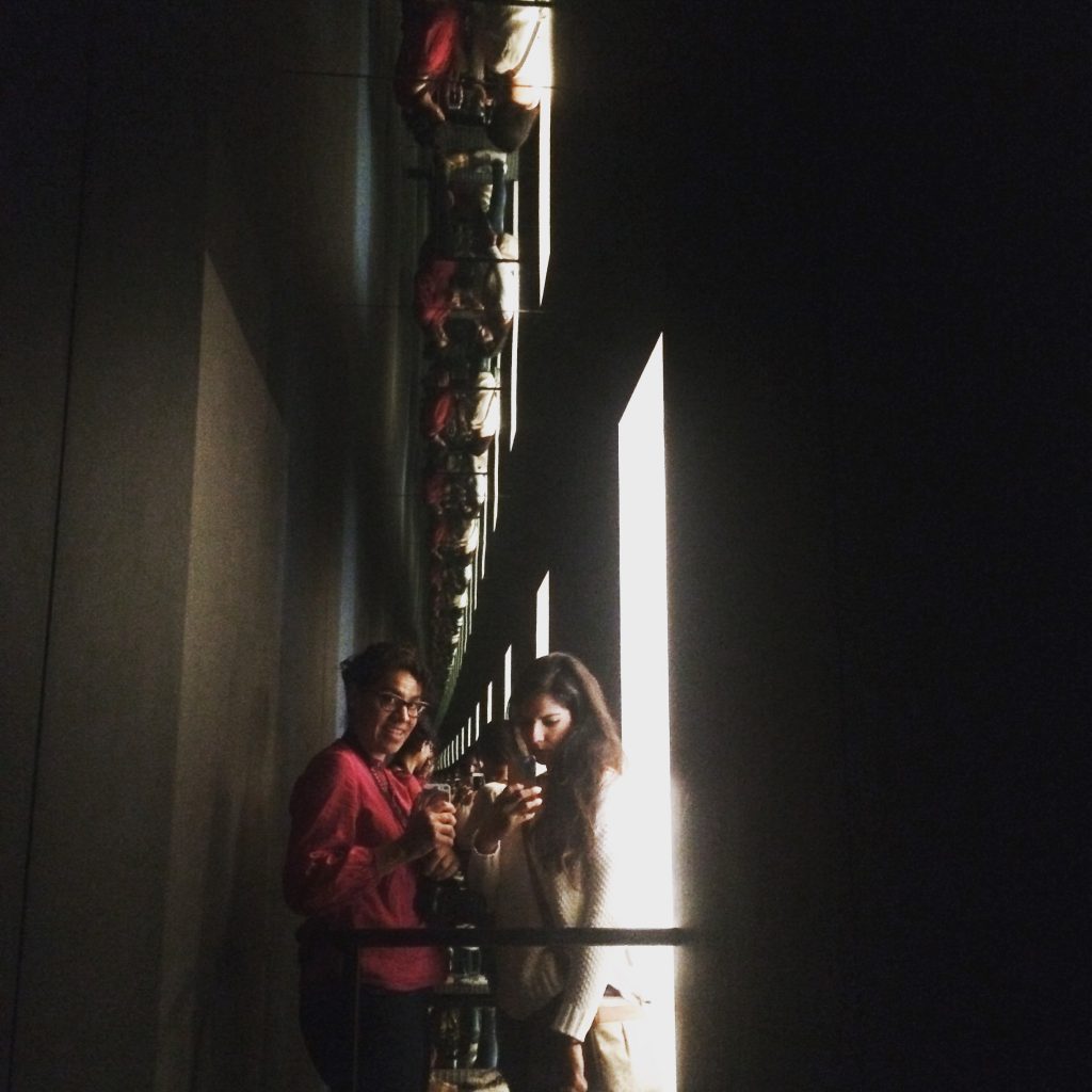 My sister and I just playing with mirrors in this installation by Olafur Eliasson.